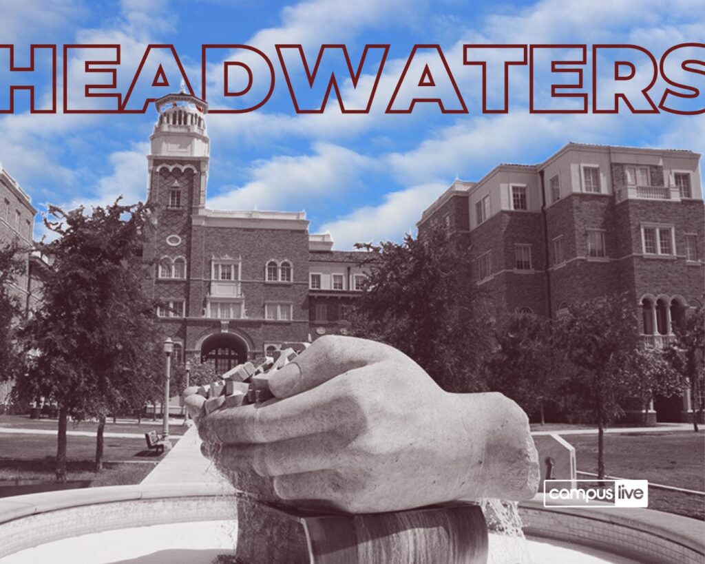 headwaters fountain is greyed out with bright blue sky and the text headwaters in the skyline